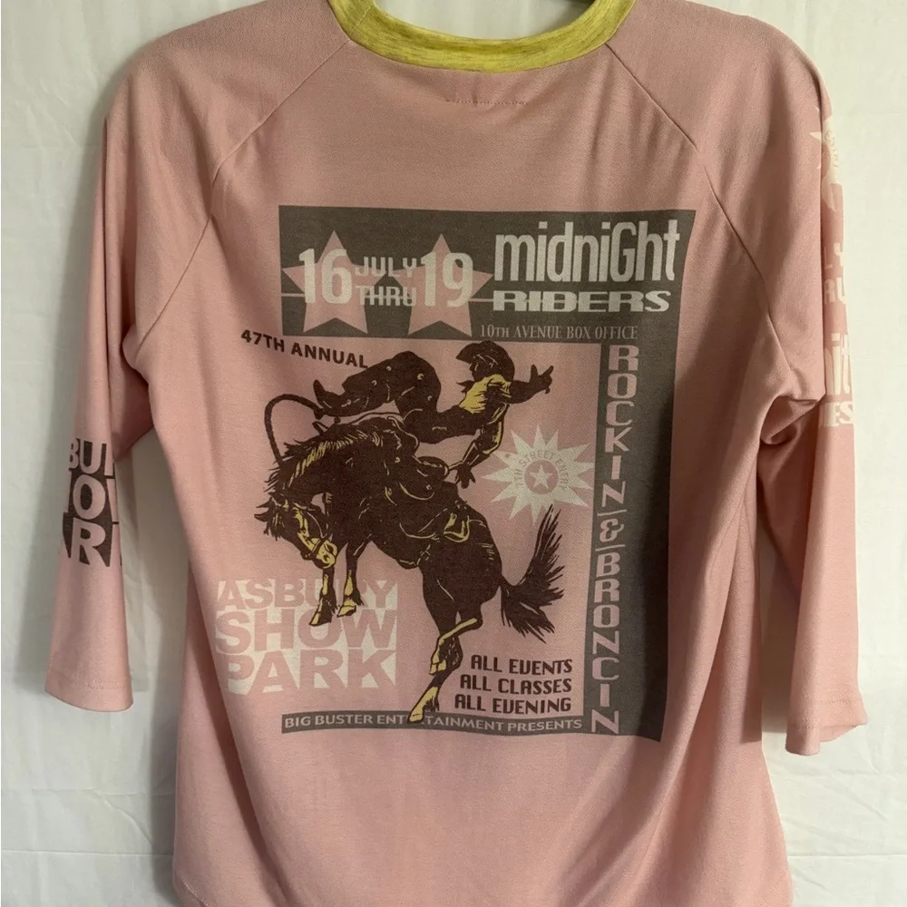 Pink graphic t-shirt with a vintage-style rodeo print. - Picture 2 of 3